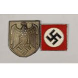 A German Third Reich Military and Political Supervision enamel badge (inscribed in Japanese?) and