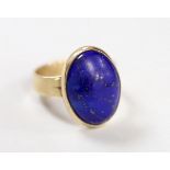 An Elizabeth II 9ct gold and oval lapis lazuli set ring, size P/Q, gross weight 6.7 grams.