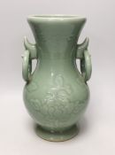 A two handled Chinese celadon glazed vase. 32cm tall