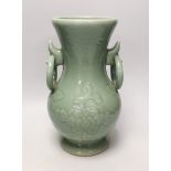 A two handled Chinese celadon glazed vase. 32cm tall