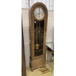 A 1920's oak cased 8 day longcase clock, height 192cm
