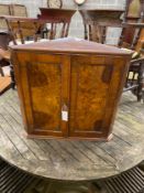 A Victorian style burr walnut hanging corner cabinet, width 63cm, depth 35cm, height 62cm