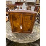 A Victorian style burr walnut hanging corner cabinet, width 63cm, depth 35cm, height 62cm