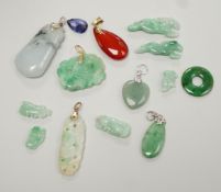 Twelve assorted carved jadeite items including five pendants, largest 40mm, a 14k mounted