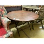 An early 20th century circular mahogany folding coaching table, diameter 91cm, height 63cm