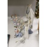 A group of Lladro and Lladro type figures (9)