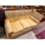 A Knole settee, upholstered in floral brocade, width 186cm, depth 80cm, height 104cm.