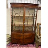 An early 20th century George III style mahogany bow front display cabinet, width 124cm, depth