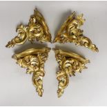 A set of four gilt wood wall brackets 22.5cm tall x 20.5cm wide