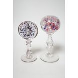 Two 19th century glass pedestal ornaments, one possibly a wig stand, the other containing a sulphide