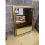 A reproduction rectangular gilt framed wall mirror, width 106cm, height 138cm