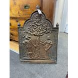 A 19th century cast iron Dutch style fireback, length 51cm, height 76cm