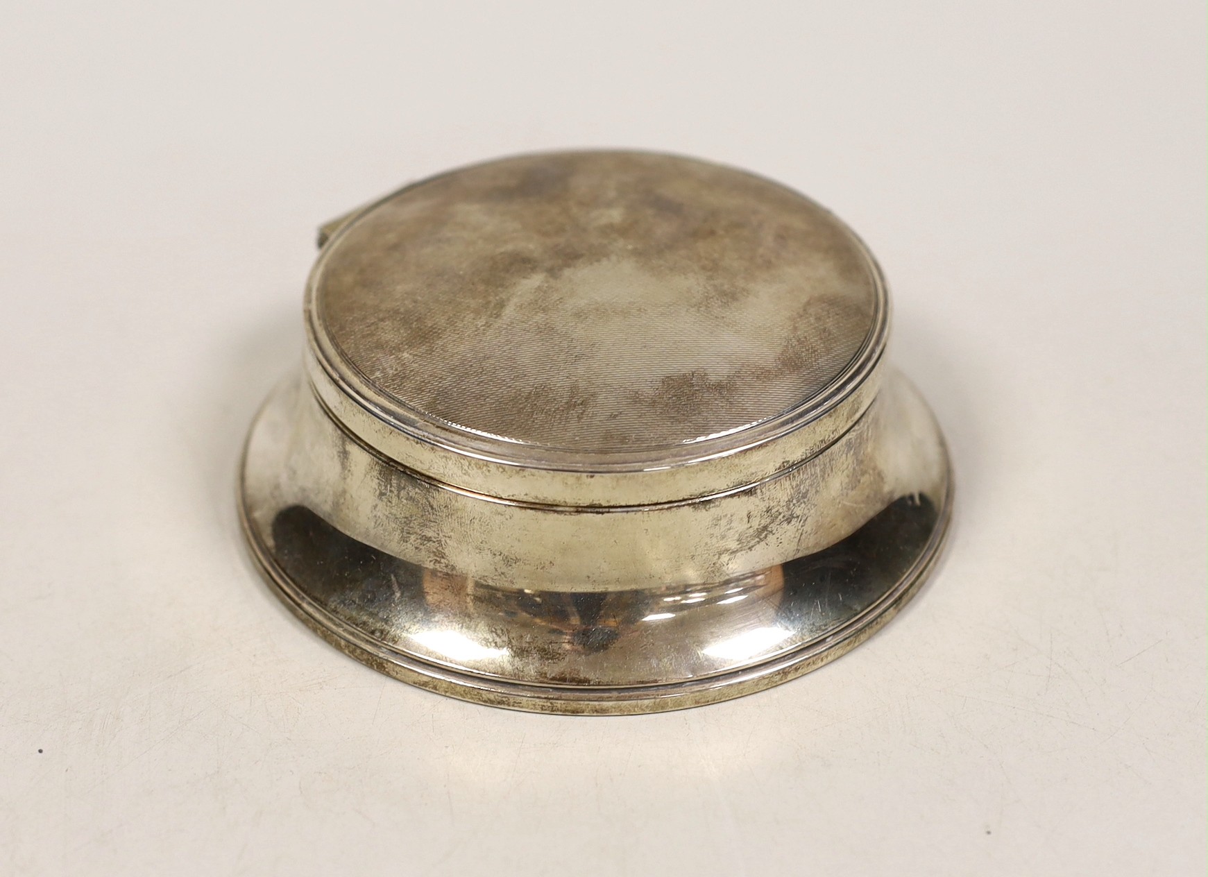 A 1950's part engine turned silver mounted circular jewellery casket, base diameter 12.8cm.