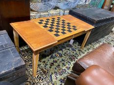A modern teak hinged top low games table, with backgammon and chess surfaces, width 98cm, depth