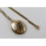 A modern 9ct gold oval locket, 33mm, on a 9ct gold chain, gross weight 16 grams.