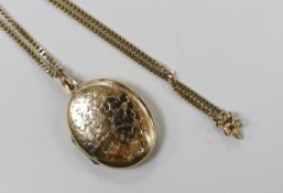 A modern 9ct gold oval locket, 33mm, on a 9ct gold chain, gross weight 16 grams.