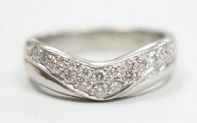 A modern platinum and diamond cluster set 'chevron' ring, size N, gross weight 9.2 grams.