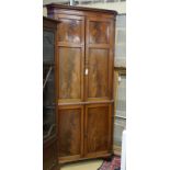 A George III mahogany standing corner cabinet, width 106cm, depth 55cm, height 228cm