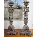 A pair French cast metal candlesticks. 47cm tall