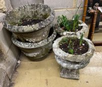 Four circular reconstituted stone garden planters, largest diameter 48cm, height 32cm