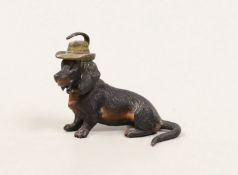An Austrian cold painted bronze of a seated Dachshund wearing a hat
