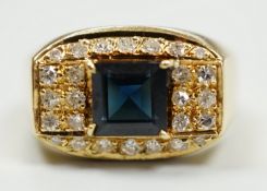 A modern 750 yellow metal, single stone sapphire and pave set diamond dress ring, size O, gross