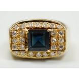 A modern 750 yellow metal, single stone sapphire and pave set diamond dress ring, size O, gross