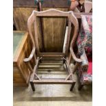 A 19th century wing back armchair frame, width 83cm, depth 60cm, height 114cm