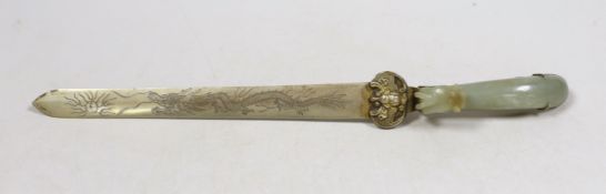 A Chinese celadon jade belt hook handled paperknife, the 19th century belt hook 8.2 cm long, total