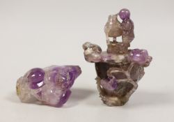 Two Chinese amethyst crystal carvings of peaches and a vase, tallest 8.5 cm
