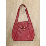 A red Cartier “Panther bag”, 54cms from the top of the handle to base of bag,