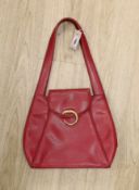 A red Cartier “Panther bag”, 54cms from the top of the handle to base of bag,