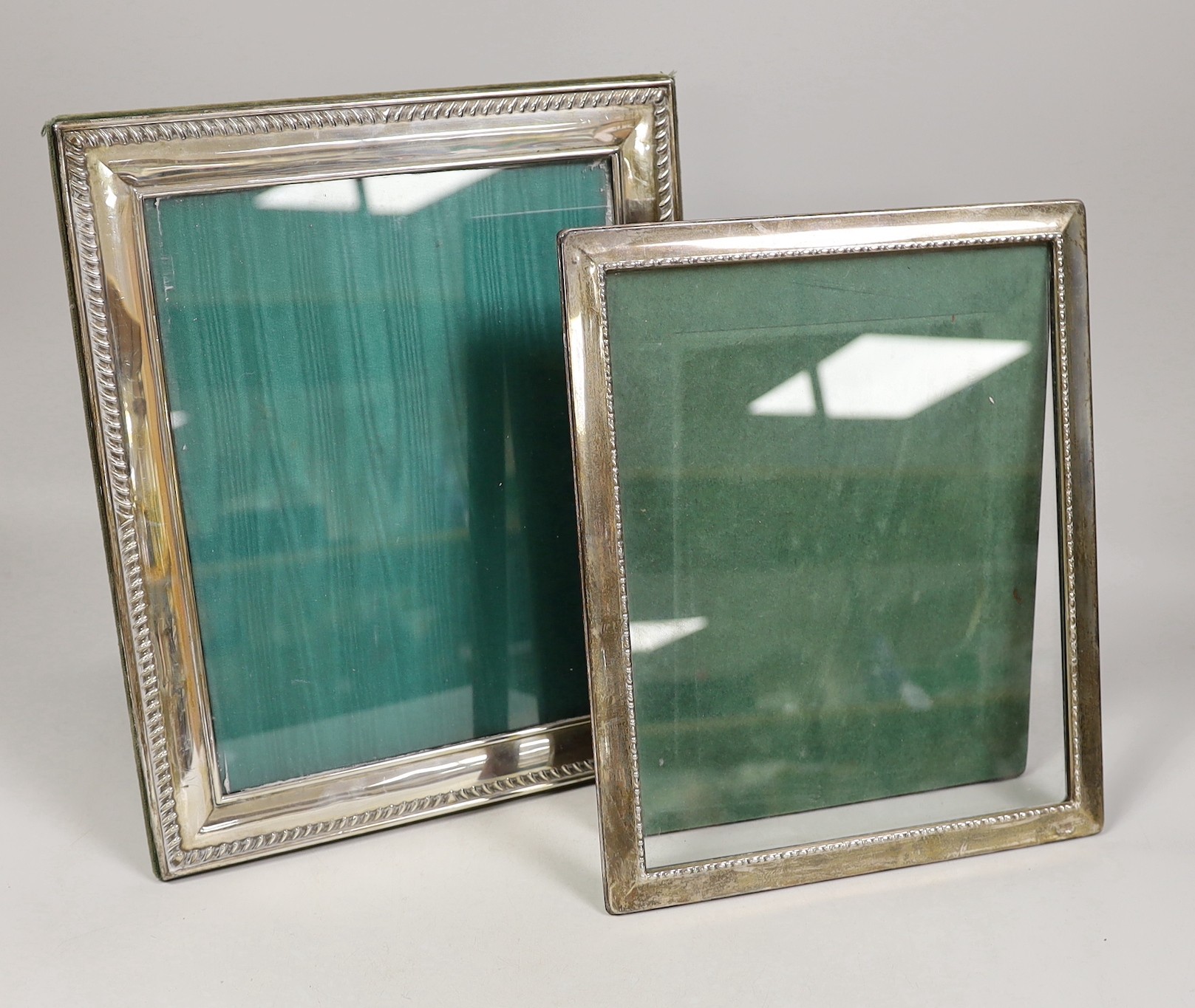 Two modern silver mounted rectangular photograph frames, largest, 32cm.