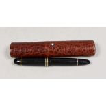 A Montblanc Meisterstuck no.149 fountain pen and a red crocodile pattern leather case