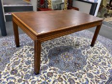 An Art Deco rectangular mahogany library table with leather inset top, bears Howard & Son retail