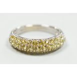 A modern 18ct white gold and yellow stone cluster set half hoop ring, size K, gross weight 4.2
