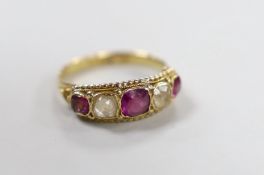 A Victorian 15ct, two stone rock crystal? and three stone garnet set half hoop ring, size L, gross