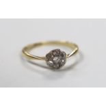 An 18ct and diamond cluster ring, size L/M, gross weight 1.4 grams.