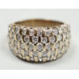 A modern yellow metal and pave set five row diamond dress ring, size R, gross weight 9.2 grams.