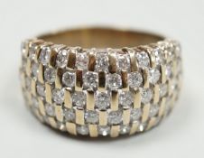 A modern yellow metal and pave set five row diamond dress ring, size R, gross weight 9.2 grams.