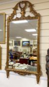 An 18th century style giltwood and composition wall mirror, width 64cm, height 128cm