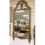 An 18th century style giltwood and composition wall mirror, width 64cm, height 128cm