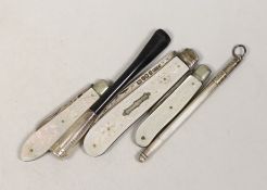 Three assorted mother of pearl mounted silver fruit knives, largest 82mm, a cigarette holder and a