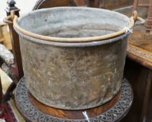 A Victorian brass and wrought iron cauldron with wrought iron swing handle, diameter 56cm, height