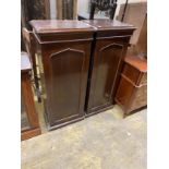 A pair of early 20th century mahogany pedestal cupboards, width 50cm, depth 36cm, height 123cm
