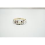 An 18ct and plat, single stone cabochon white opal and two stone diamond set ring, size L/M, gross