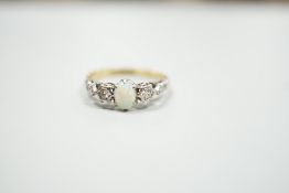 An 18ct and plat, single stone cabochon white opal and two stone diamond set ring, size L/M, gross