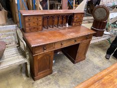 A Victorian style mahogany kneehole desk, length 140cm, depth 64cm, height 110cm