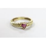 A 1970's 9ct gold and collet set heart shaped single stone garnet ring, size M/N, gross weight 2.1