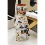 A Japanese Arita or Imari porcelain tripod urn, 29.5 cm high